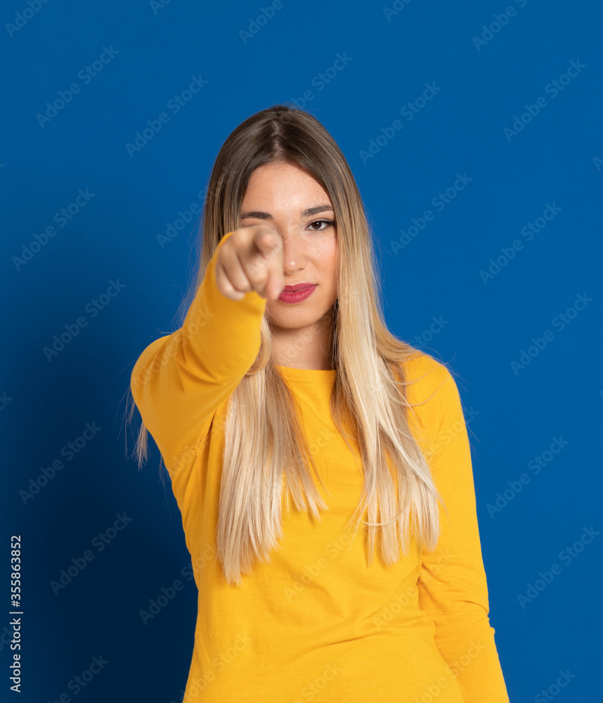 Blonde girl wearing a yellow T-shirt Blonde girl wearing a yellow T-shirt