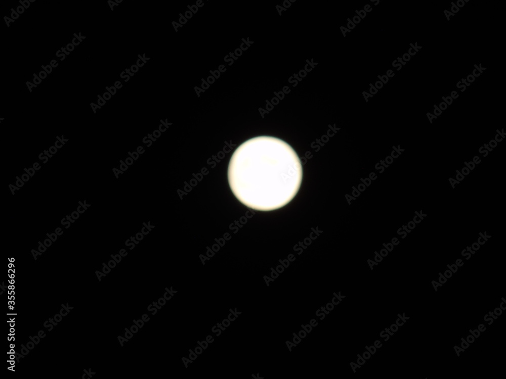 An amazing photography of the full moon over the city of Genova by night with a great clear sky in background and some stars An amazing photography of the full moon over the city of Genova by night with a great clear sky in background and some stars