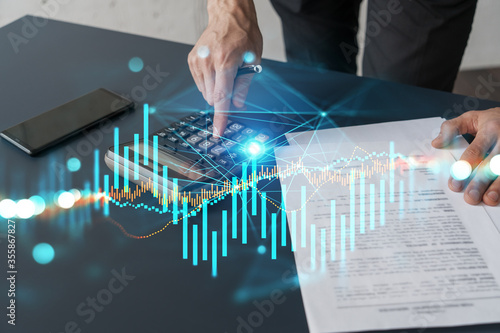 Slika na platnu Double exposure of man sign a brokerage contract and financial chart