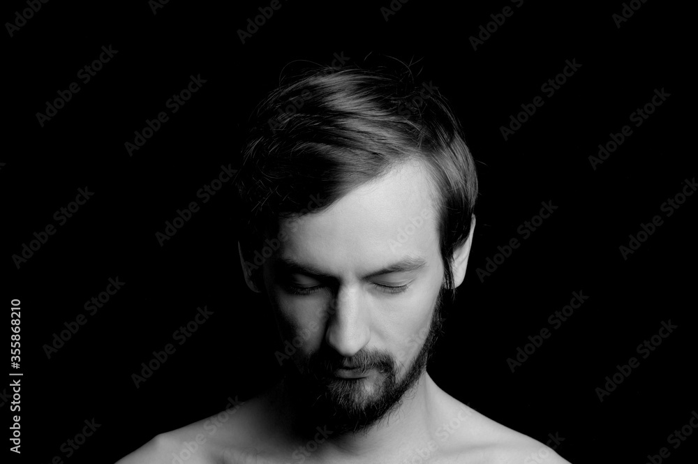 portrait of a guy with a beard on a black background