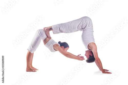 Couple practicing acro yoga