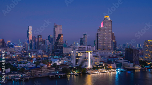 Aerial and panorama view of Bangkok skyscraper cityscape and river in twilight blue hour