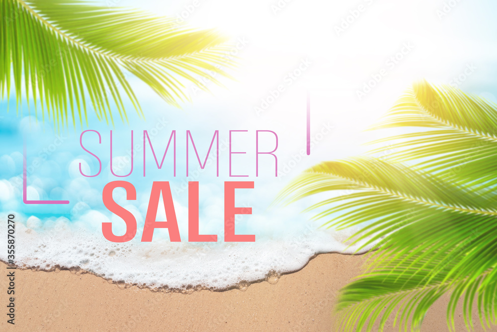 Summer sale words on blur tropical beach with bokeh sunlight wave abstract background. Summer vacation and travel holiday business concept.