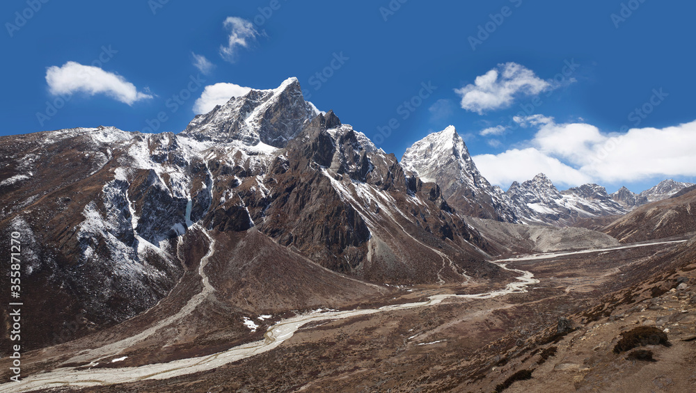 Himalayan mountain landscape with panoramic view of Cholatse and Taboche mountains on the road to Everest Base Camp in Sagarmatha National Park, Khumbu, Nepal