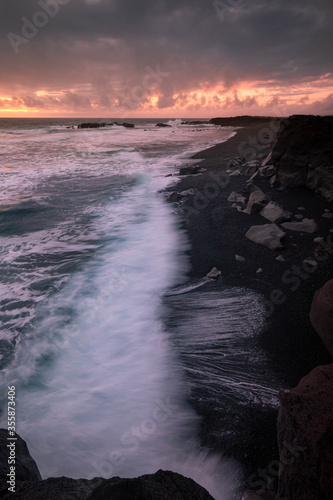 Black beach during sunset - Iceland photo