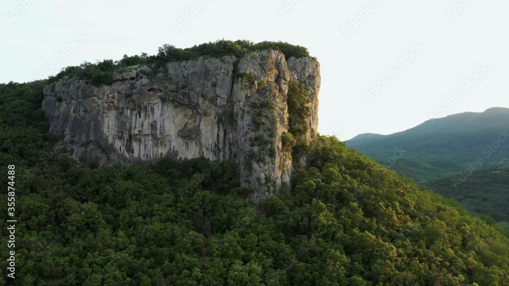 Aerial revolving shot of a cliff with a beautiful sunset light Aerial revolving shot of a cliff with a beautiful sunset light