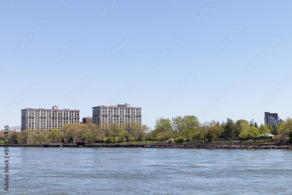 Residential Buildings in the Roosevelt Island Skyline along the East River in New York City during Spring