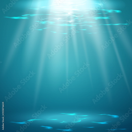 Swimming pool with blue water, ripples and highlights. Texture of water surface and tiled bottom. Overhead view. Summer background.
