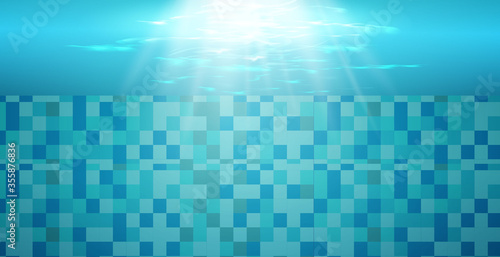  Swimming pool with blue water, ripples and highlights. Texture of water surface and tiled bottom. Overhead view. Summer background. 