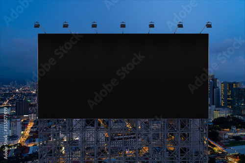 Photography Blank black road billboard with Kuala Lumpur cityscape background at night time