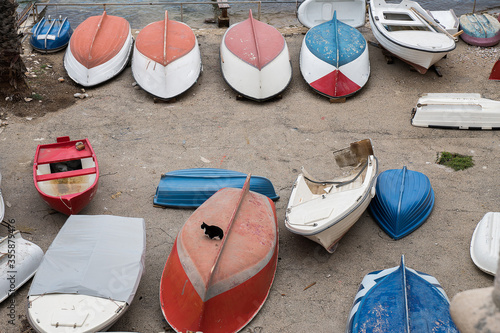 Boat in pavement ground parking by the shore