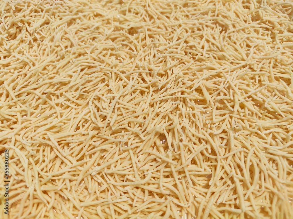 Uncooked Vermicelli pasta background made using refined floor wheat. Uncooked Vermicelli pasta background made using refined floor wheat.