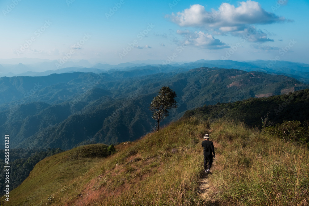 the man walking along way on the top of Monk Lui Luang, Doi Thule, Tak province, Thailand, 1350 msl