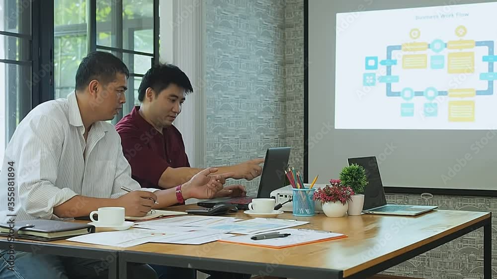 Business team meeting and discussing project plan. Businessmen discussing together in meeting room. Professional investor working with business project together. Business team meeting and discussing project plan. Businessmen discussing together in meeting room. Professional investor working with business project together.