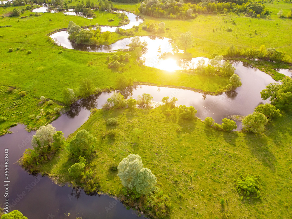 aerial drone landscape of river in green field, top view of beautiful nature texture from drone