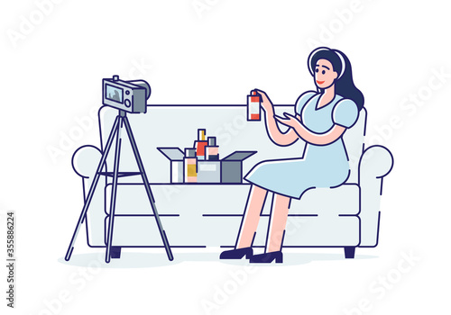 Girl beauty blogger filming new video for channel presenting new cosmetics review