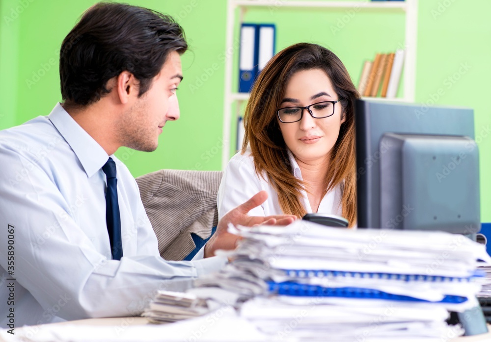 Two financial specialists working in the office Two financial specialists working in the office