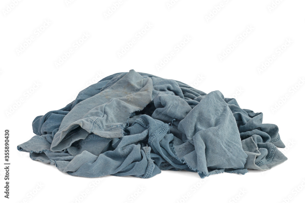 Old dirty ragged cloth with shadow isolated on a white background. Blue gray fabric with brown spots. Crumpled torn rag. Copy space
