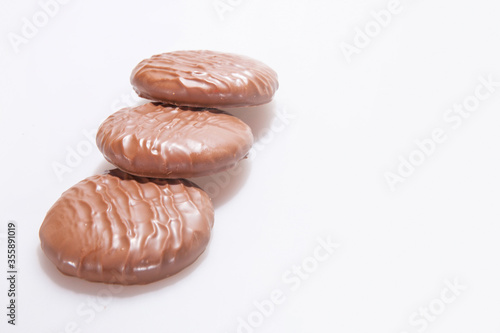 Chocolate Protein bars filled with chocolate sauce, cut on a white background