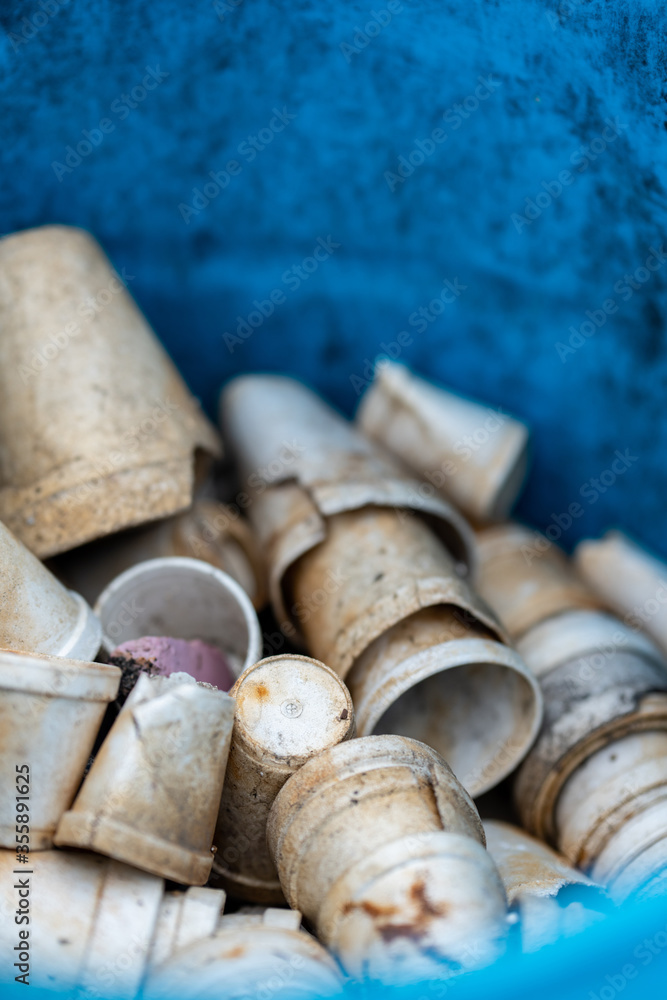 Non biodegradable styrofoam cups in a trash can Non biodegradable styrofoam cups in a trash can
