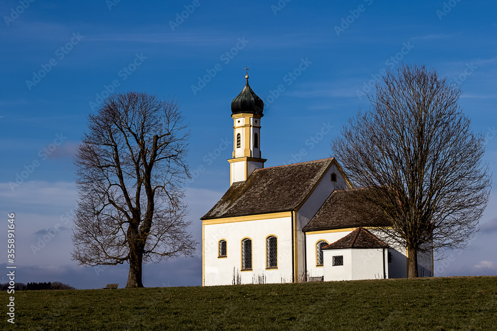 small chapel against a blue sky in upper bavaria small chapel against a blue sky in upper bavaria