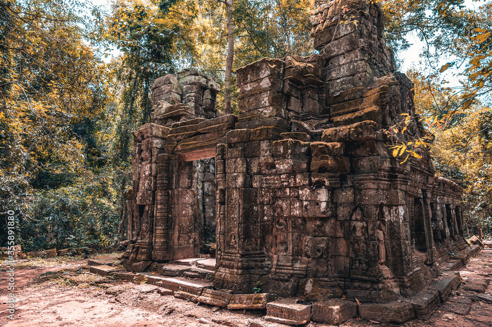 Ruins of the small temples Thom Manon and Chau Say Tevoda located next to the Angkor Thom in Angkor Wat complex in Siem Reap Cambodia. Famous tourist and travel destinatoin in the middle of the jungle