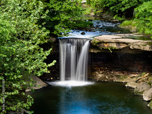 A beautiful creamy  milky waterfall with the motion frozen  nestled into a park in New Castle  Pennsylvania.  Beauty in nature  landscape photography.