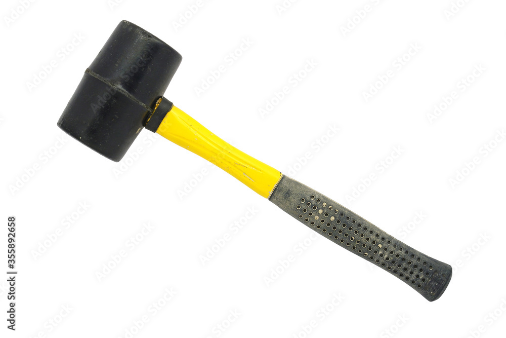 Used dirty rubber mallet isolated on a white background. Black and yellow rubber hammer with stains and scratches. Closeup. Copy space Used dirty rubber mallet isolated on a white background. Black and yellow rubber hammer with stains and scratches. Closeup. Copy space