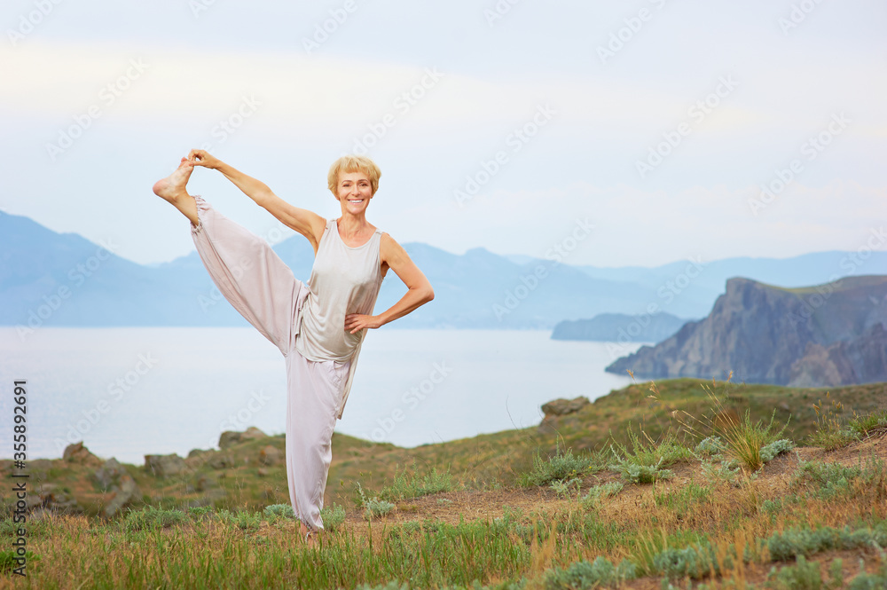 Senior woman doing yoga exercises Senior woman doing yoga exercises