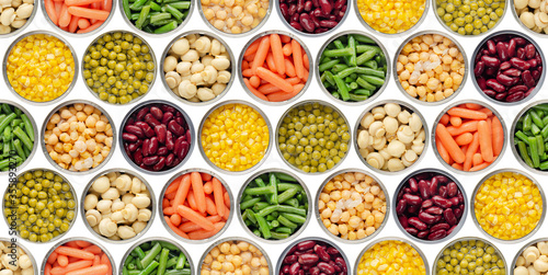 Seamless food background made of opened canned chickpeas, green sprouts, carrots, corn, peas, beans and mushrooms on white background