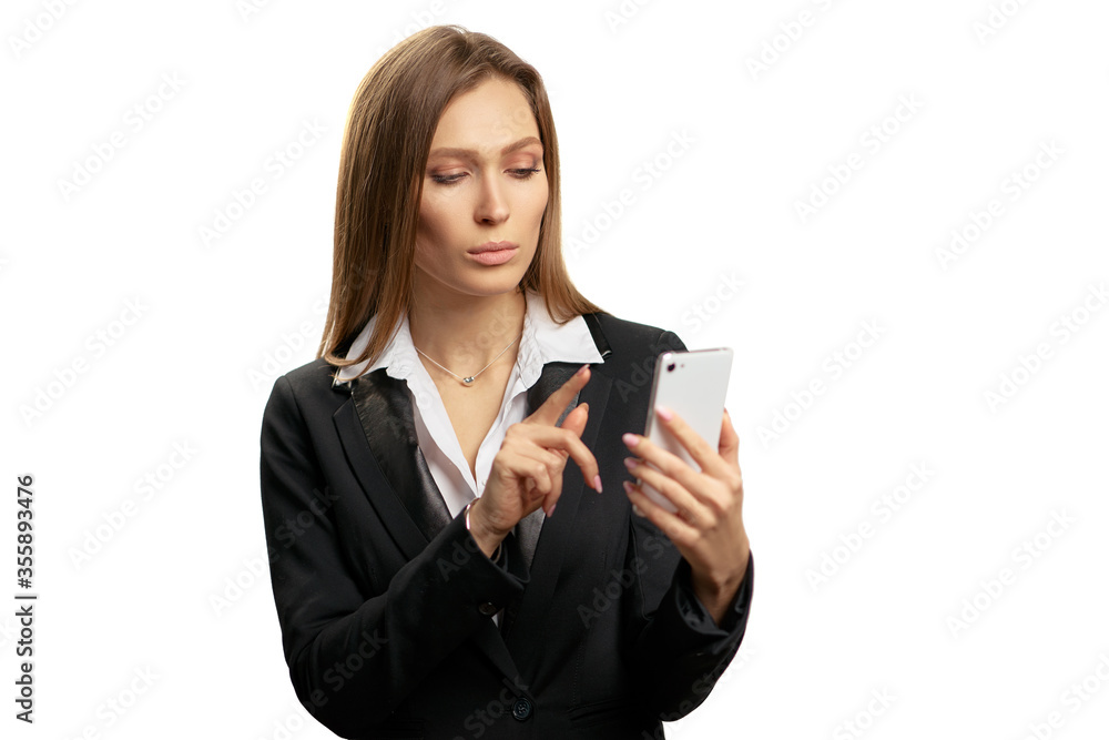 Studio portrait of young business woman using smartphone. Isolated on white. Studio portrait of young business woman using smartphone. Isolated on white.