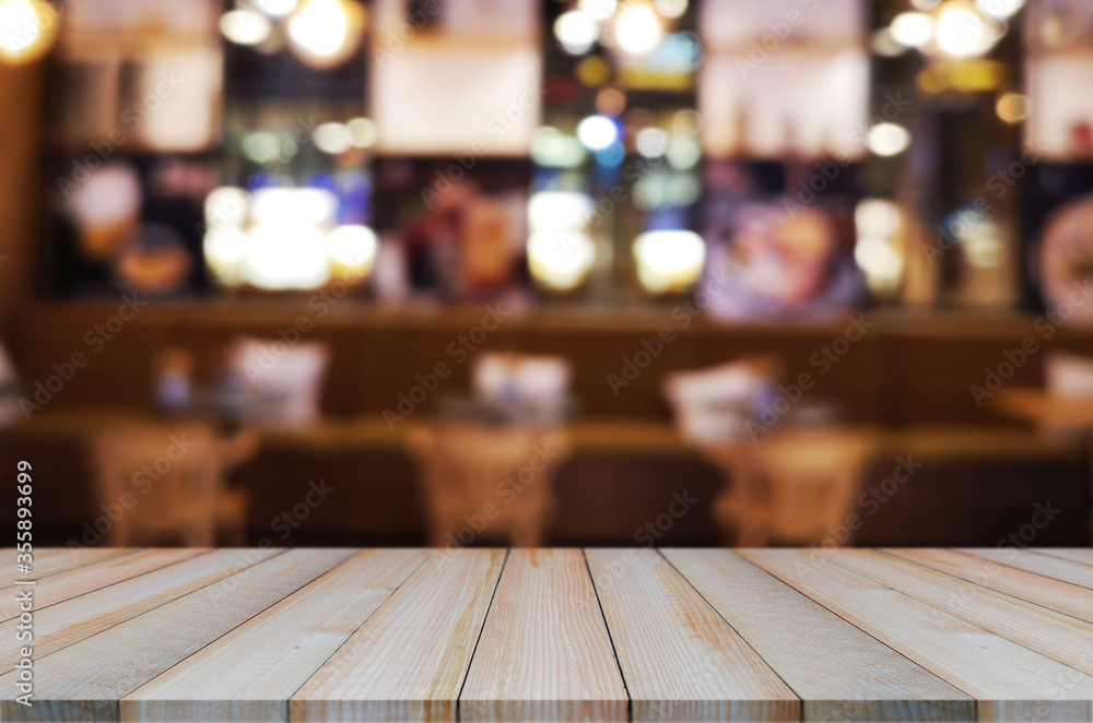 wooden table with abstract blurred background resturant lights used for display montage products mock up design. wooden table with abstract blurred background resturant lights used for display montage products mock up design.