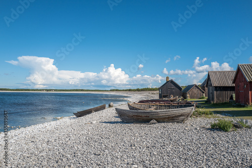 Fototapeta Naklejka Na Ścianę i Meble -  Helgumannens fishing village on Swedish Baltic sea island Faro on northern Gotland. This is a major tourist attraction today.