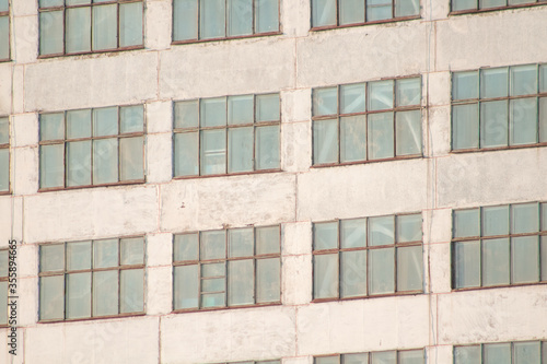 Large blue repeating building windows close-up background
