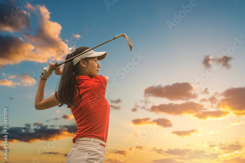 Wallpaper Mural Female golf player playing golf in professional golf course. Torontodigital.ca
