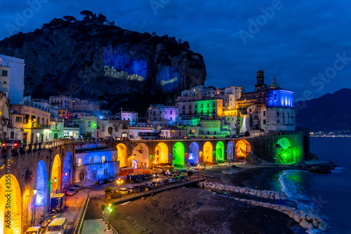 Fototapeta Naklejka Na Ścianę i Meble -  Naples, Italy, December 2019: Colored christmas lights in Atrani, Atrani is a small town on the Amalfi coast, Naples, Italy.