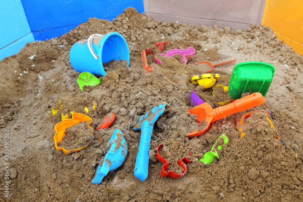 Children's sandbox with various toys for the game. Children's sandbox with various toys for the game.