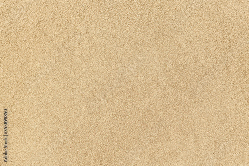 Background and texture of clean sand of a beach