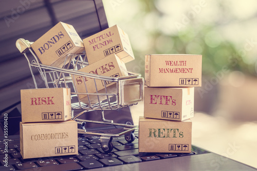Obraz na plátně Online wealth creation and management for sustainable growth, asset allocation and investment concept : Boxes of financial products e