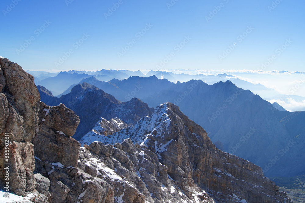Scenic view from the Zugspitze, Germany's highest point with 2962 m (9718 ft) above sea level on a wonderful, sunny day with blue sky.