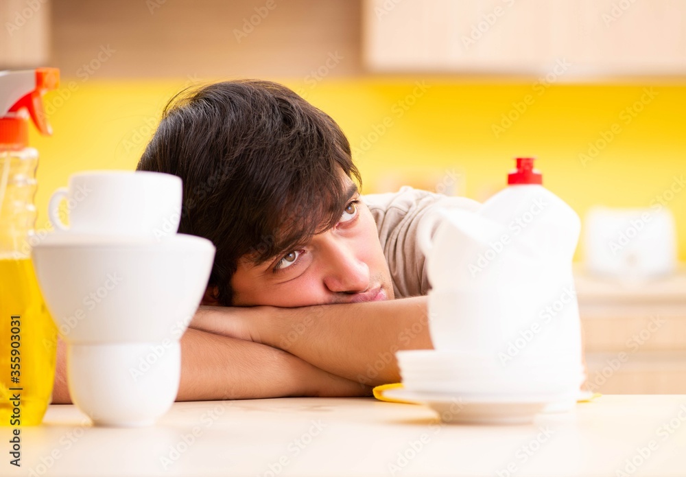 Man washing dishes at home