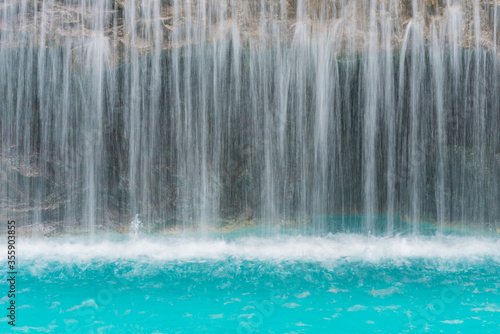 landscape of beautiful Artificial waterfall in garden at the public park