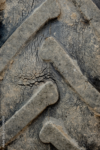 Detail of an old, cracked tractor tire