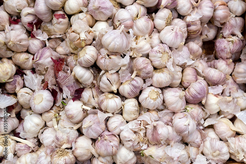 garlic at the supermarket kiosk. Fresh garlic on display in the grocery store.