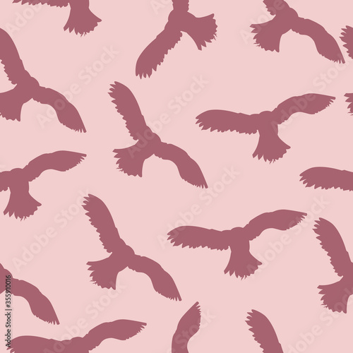 Flying owl endless pattern. silhouette on a pink background