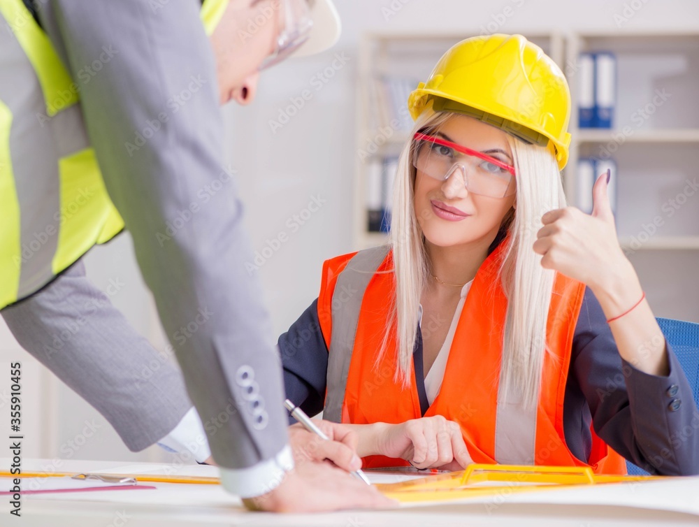 Construction workers having discussion in office before starting Construction workers having discussion in office before starting