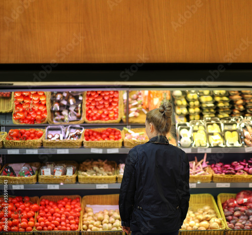 Supermarket shopping, face mask and gloves,Woman buying vegetables at the market 