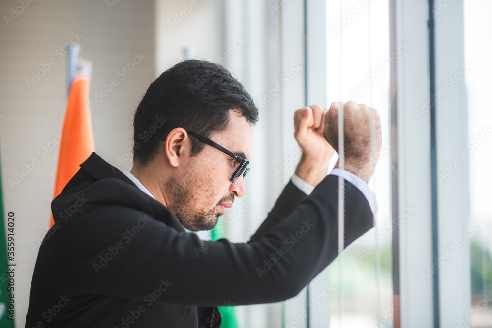 Fototapeta premium businessman failing and serious in office, concept of feeling hopeless, distraught, sad and discouraged in life