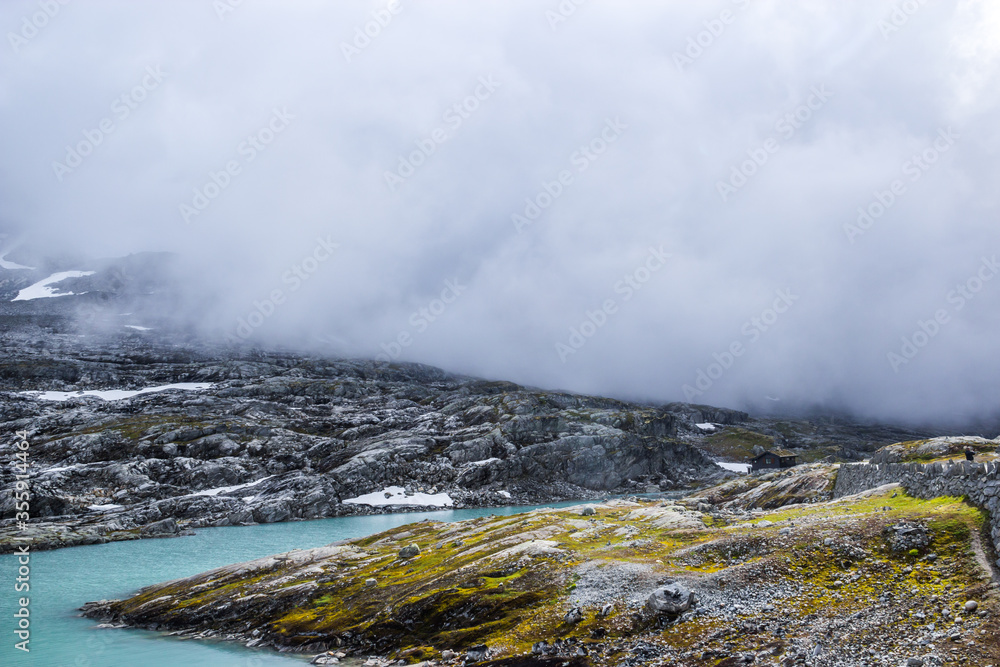 heavy clouds over the lake in the mountains of Norway 