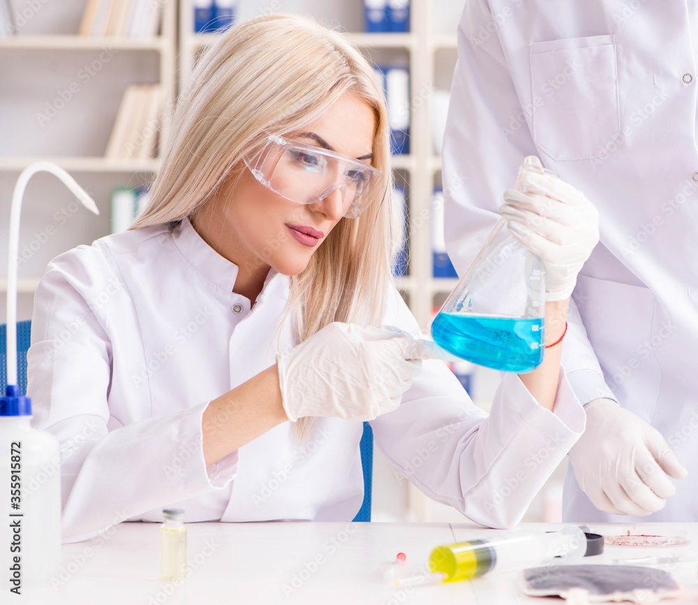 Young woman chemist working in clinic lab Young woman chemist working in clinic lab